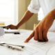 hands of engineer working on blueprint,construction concept. eng